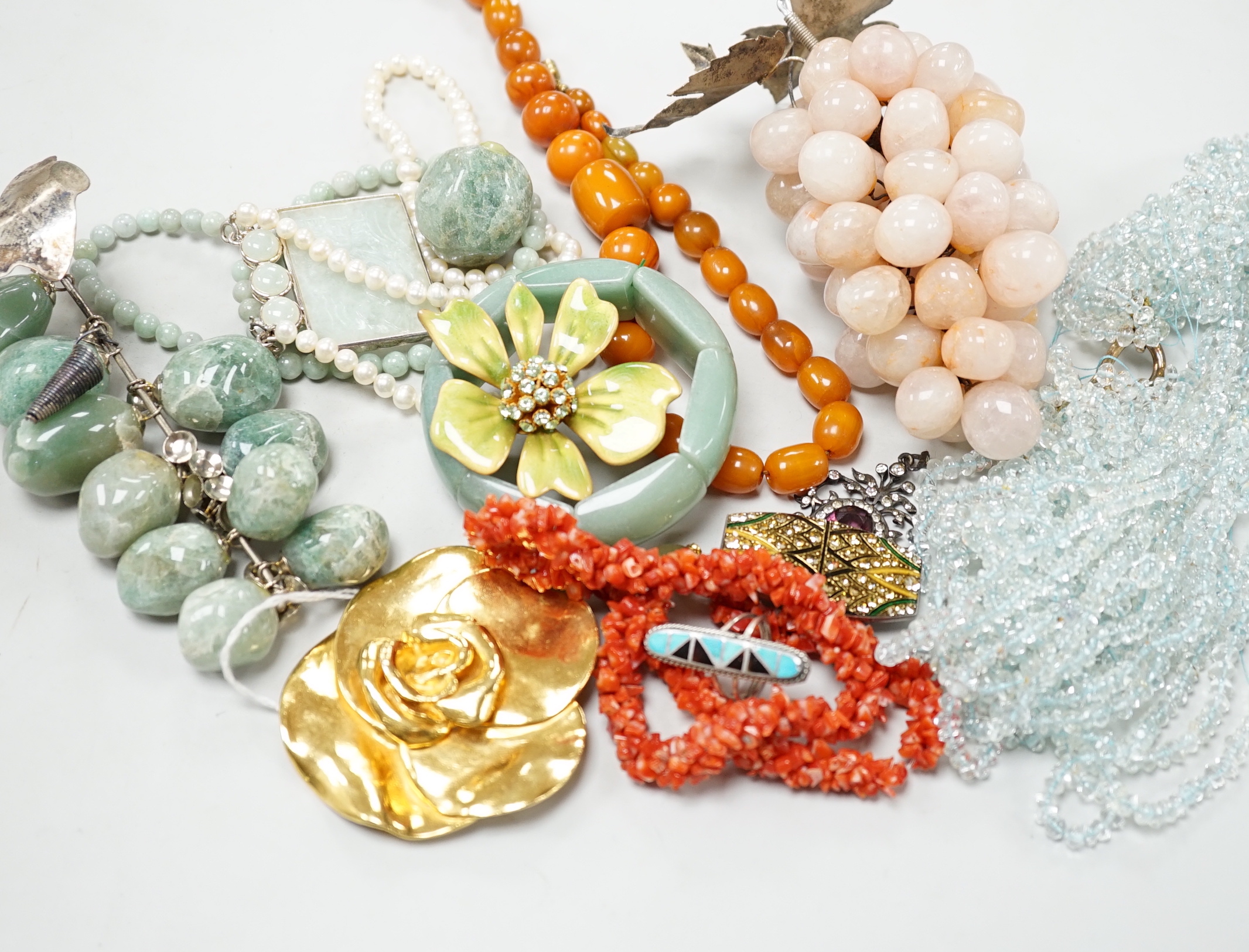 A quantity of assorted costume jewellery, necklaces, simulated amber, paste pendant, silver ingot pendant, Enico Sport watch, jargoon? set brooch, etc.